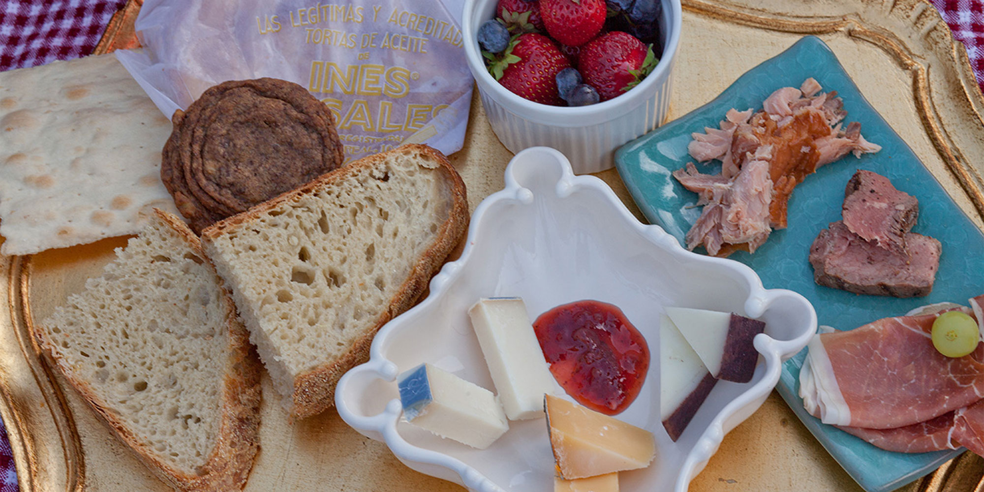 meats and cheese on a charcuterie board