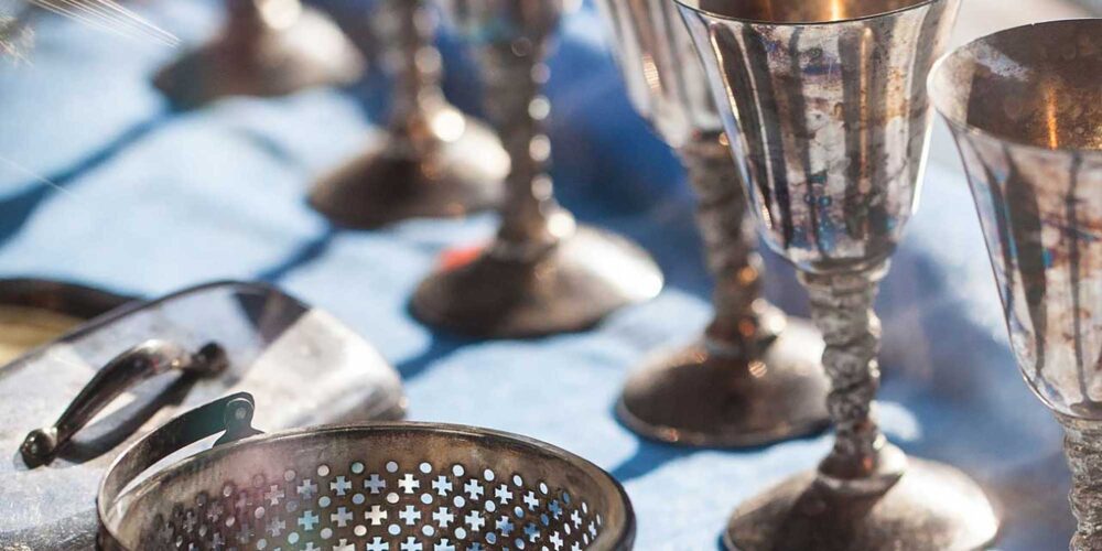 antique cups sitting on a table