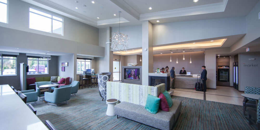 hotel lobby with guests at the desk