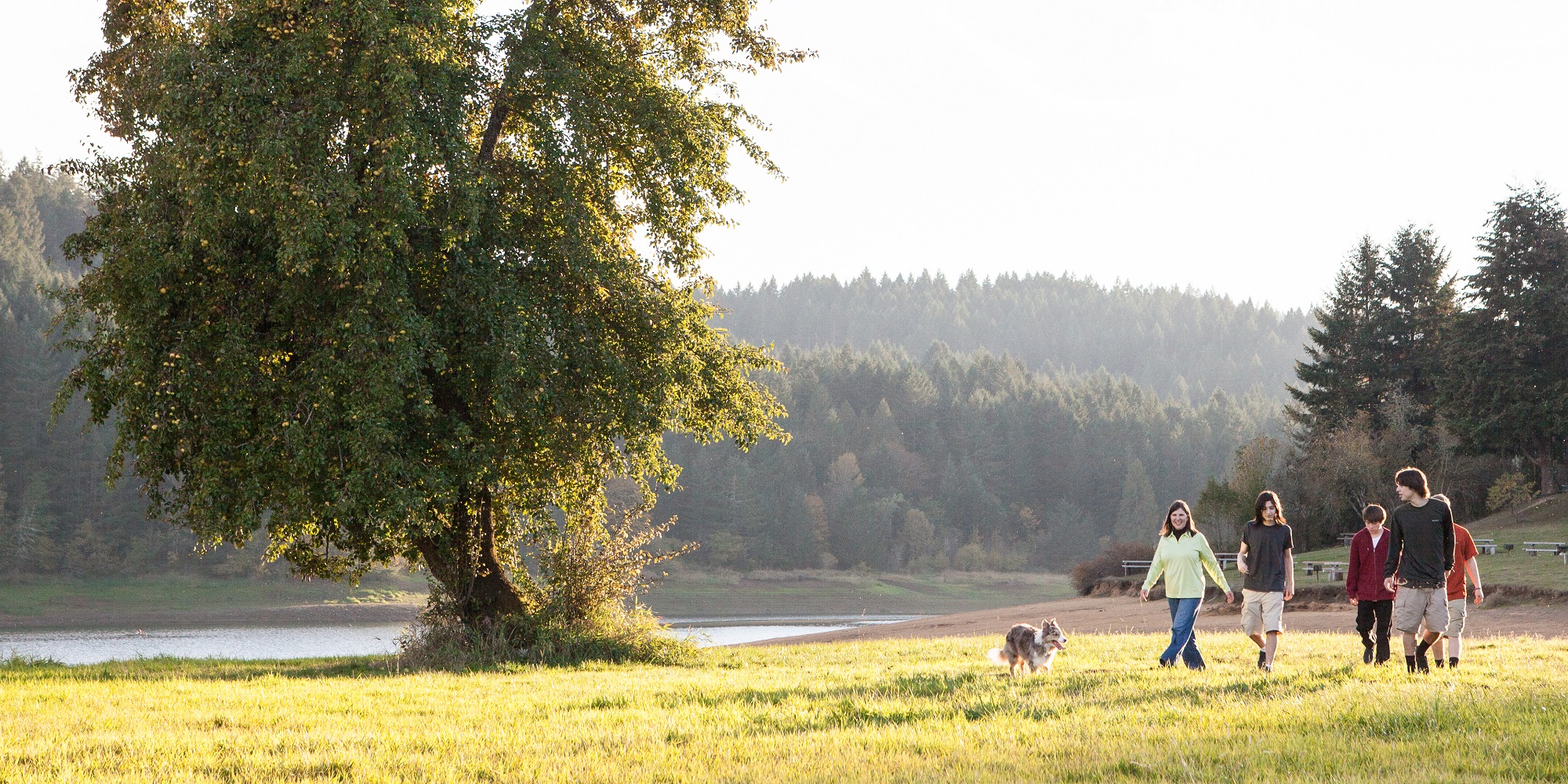 Family playing with a dog at Scoggins Valley Park