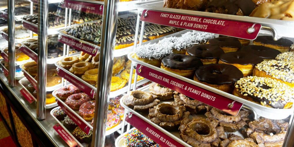 cabinet full of a variety fo donuts