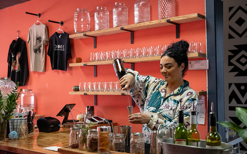 woman pouring a drink