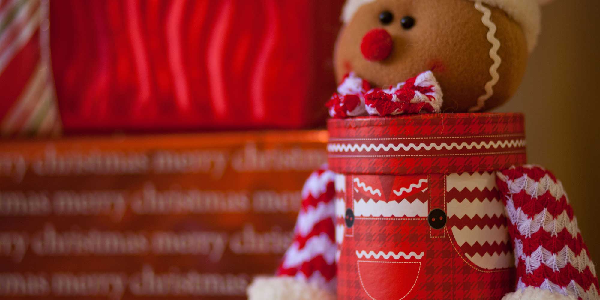 gingerbread man holding a present